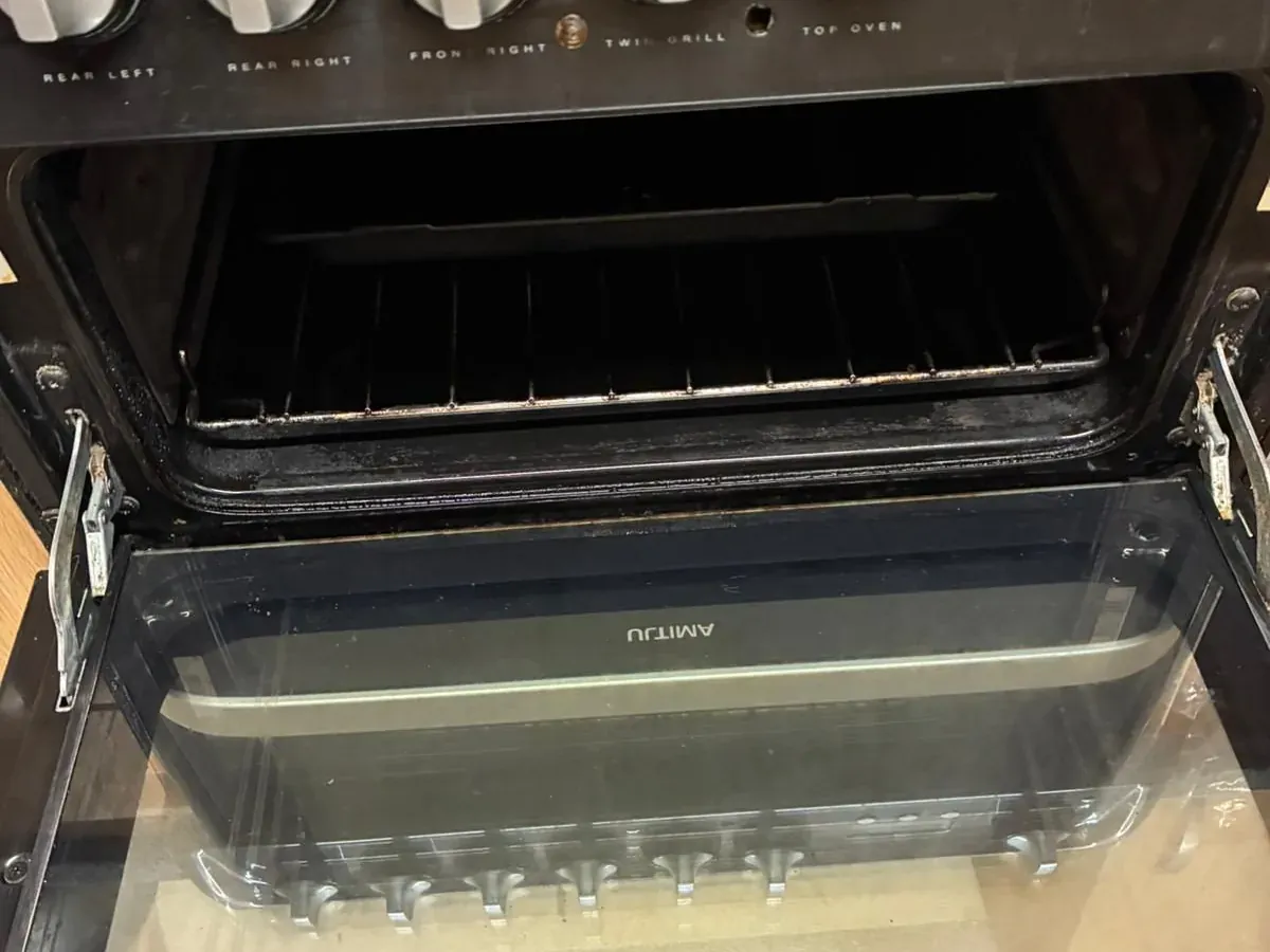 After: Oven interior — burnt-on grease and carbon removed, racks and glass done
