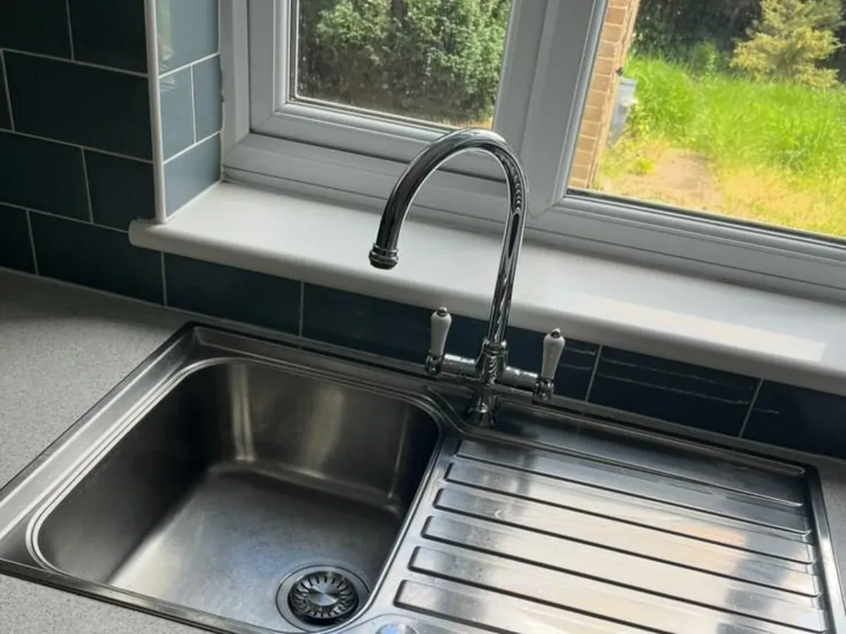 After: Kitchen sink and drainer — limescale, rust marks and grime cleared